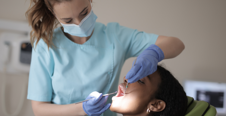 A dentist examining a patient.
