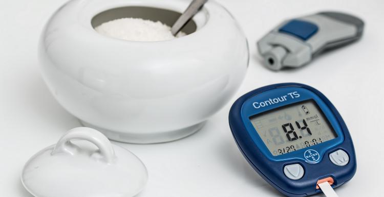 blood sugar monitor and sugar bowl