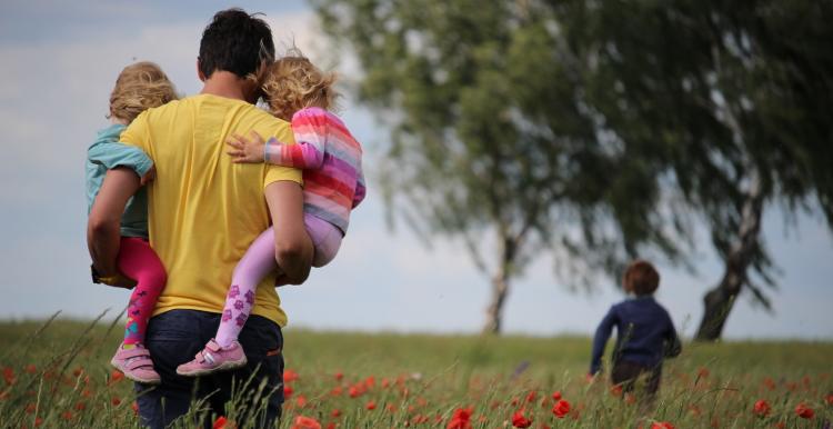 family walking through field