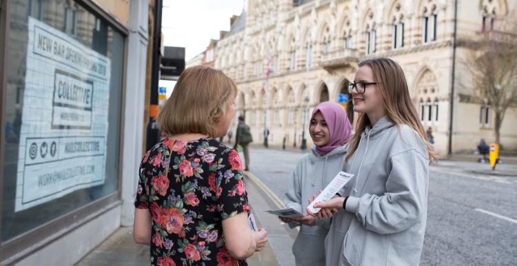 group of women talking in the street