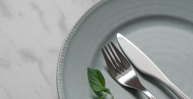 knife and fork on empty white plate