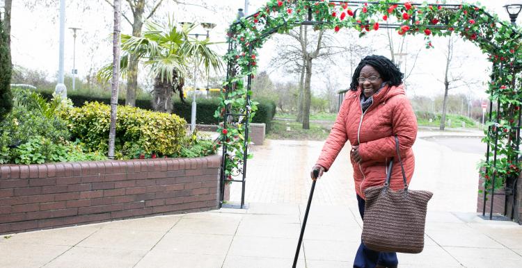 woman walking with stick