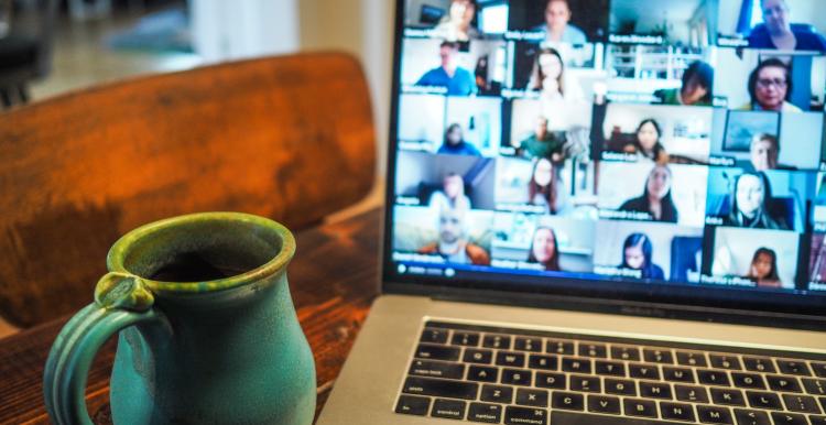 people in a virtual meeting on laptop screen