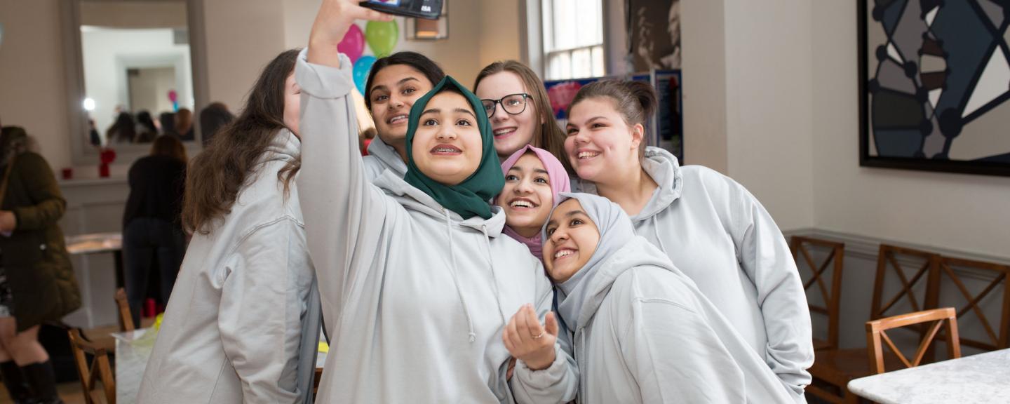 young volunteers taking a group selfie
