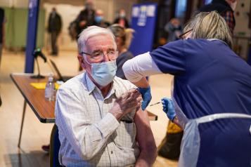 man receiving covid vaccine