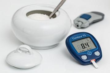 blood sugar monitor and sugar bowl