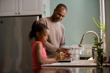 father and daughter in kitchen