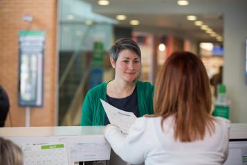 Lady at reception in a health service